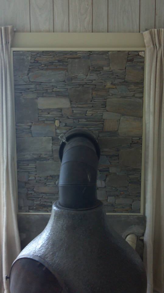 Pot belly stove, heat shield, river rock, Scarborough, Maine