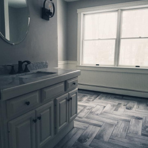 Herringbone, wood-plank look tile, and vanity install
